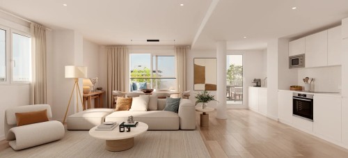 Espacio diáfano que combina salón, comedor y cocina de diseño en un piso de Insur Elyonia, destacando el minimalismo, los acabados premium y la conexión con el exterior.